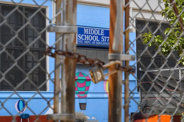 A padlocked gate outside Middle School 577 in Williamsburg, Brooklyn.